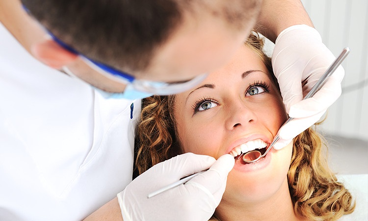 Why is it good to regularly visit a dentist?